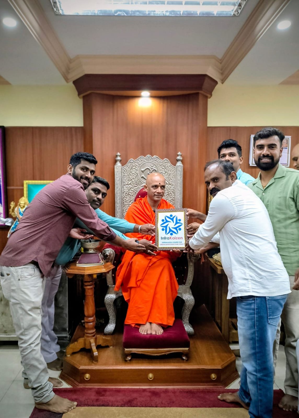Infra Kaizen team presenting memento to Jagadguru Sri Sri Sri Dr. Nirmalanandanatha Mahaswamiji